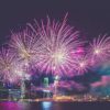 purple fireworks over a city